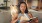 lady reading book on couch J Centra Burlington NJ apts for rent 