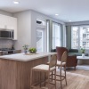 kitchen with large island and living room  with seating  Mount Holly NJ apartments for rent J Centra Burlington 