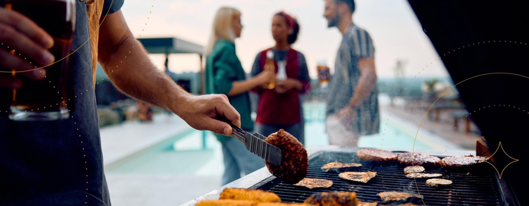 people gathering and a person cooking food on a grill on rooftop J Centra Burlington NJ apts for rent 