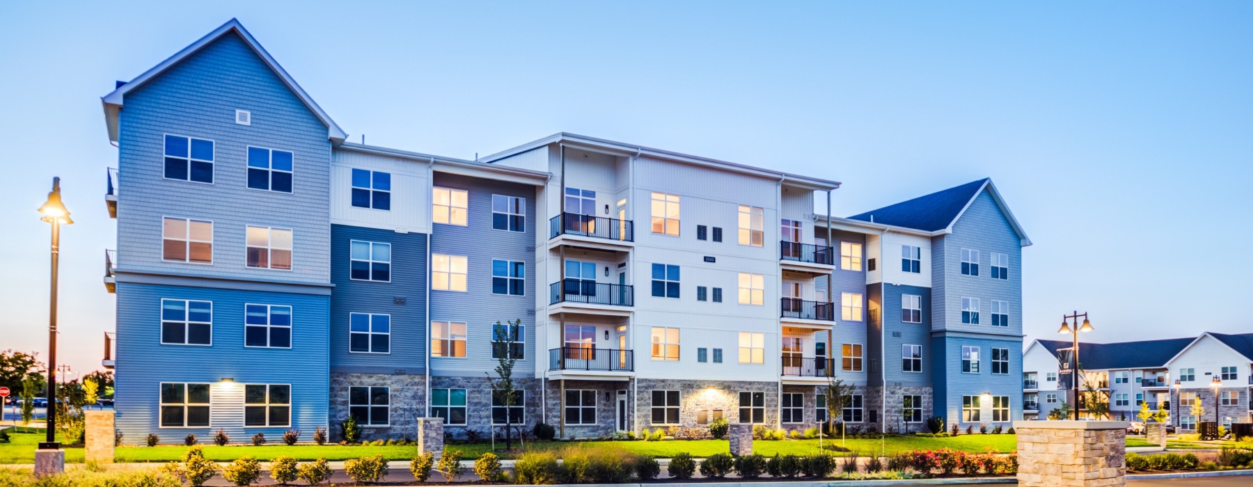 building exterior at dusk J Centra Burlington NJ luxury apartments 