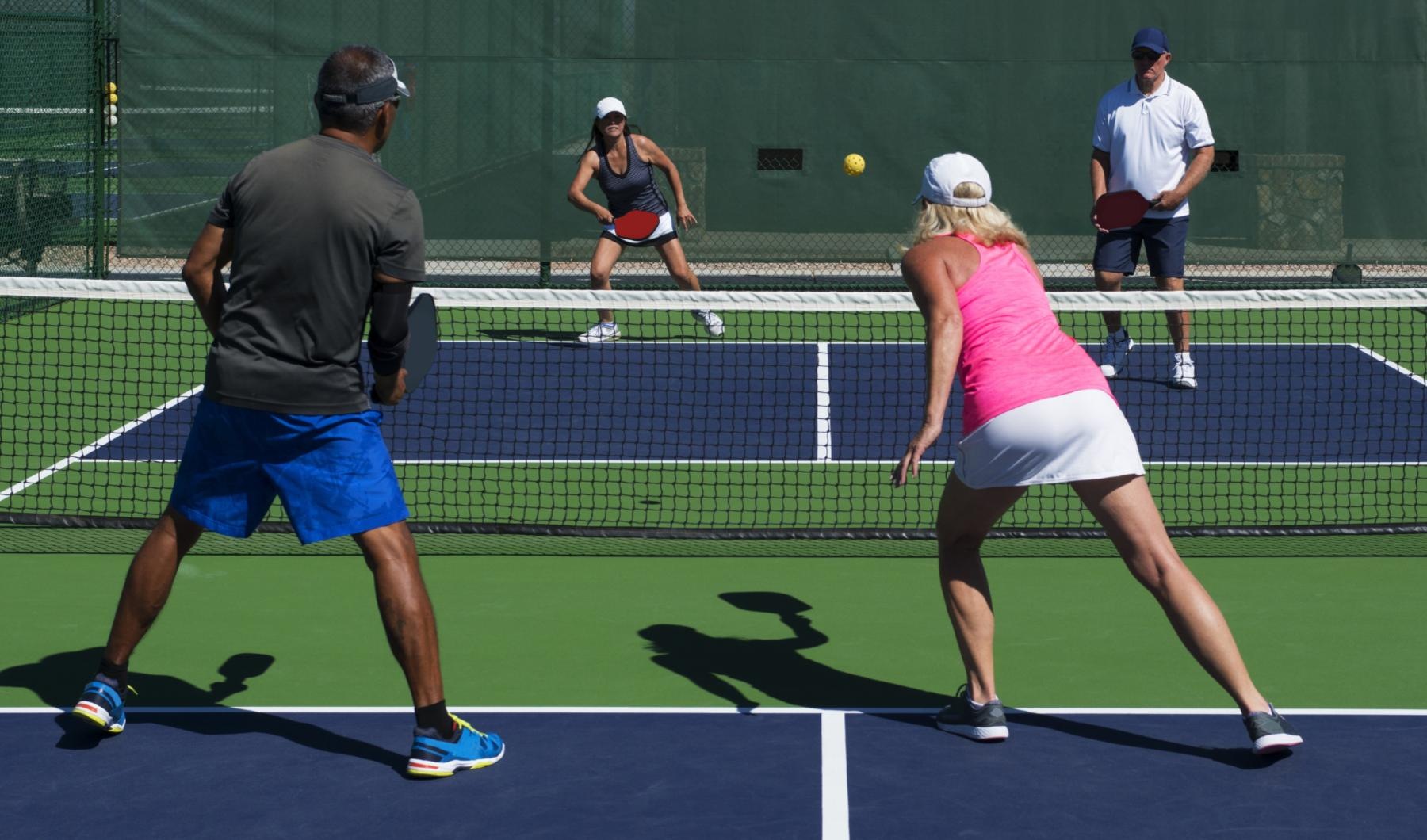 Settle into comfort at J Centra Burlington people playing pickleball Mount Holly NJ apartments for rent J Centra Burlington