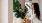 a woman watering a plant Mount Holly NJ apts for rent J Centra Burlington 